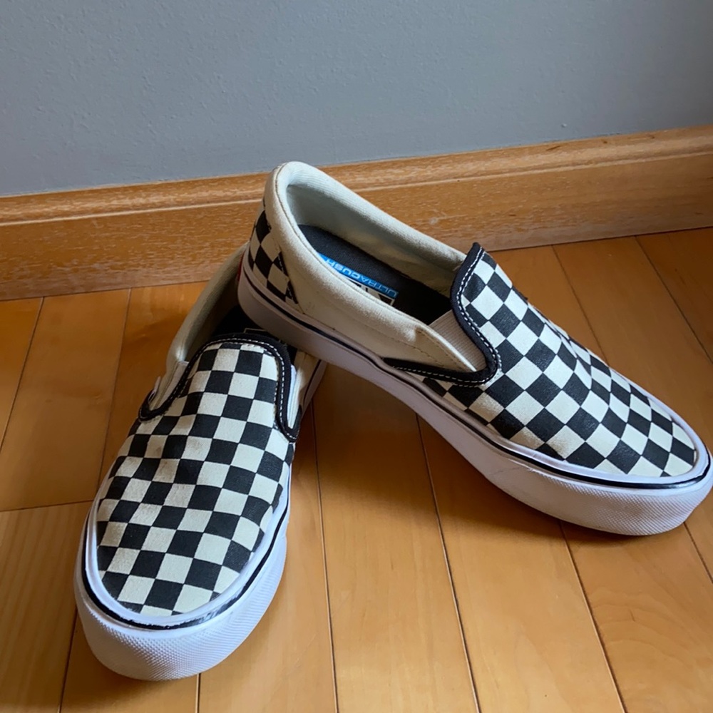 Black checkered Vans